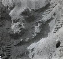 Photograph showing excavation of the  tomb no. 303 at el-Riqqa, both during the works and afterwards.Engelbach 1915: plate II fig. 4.